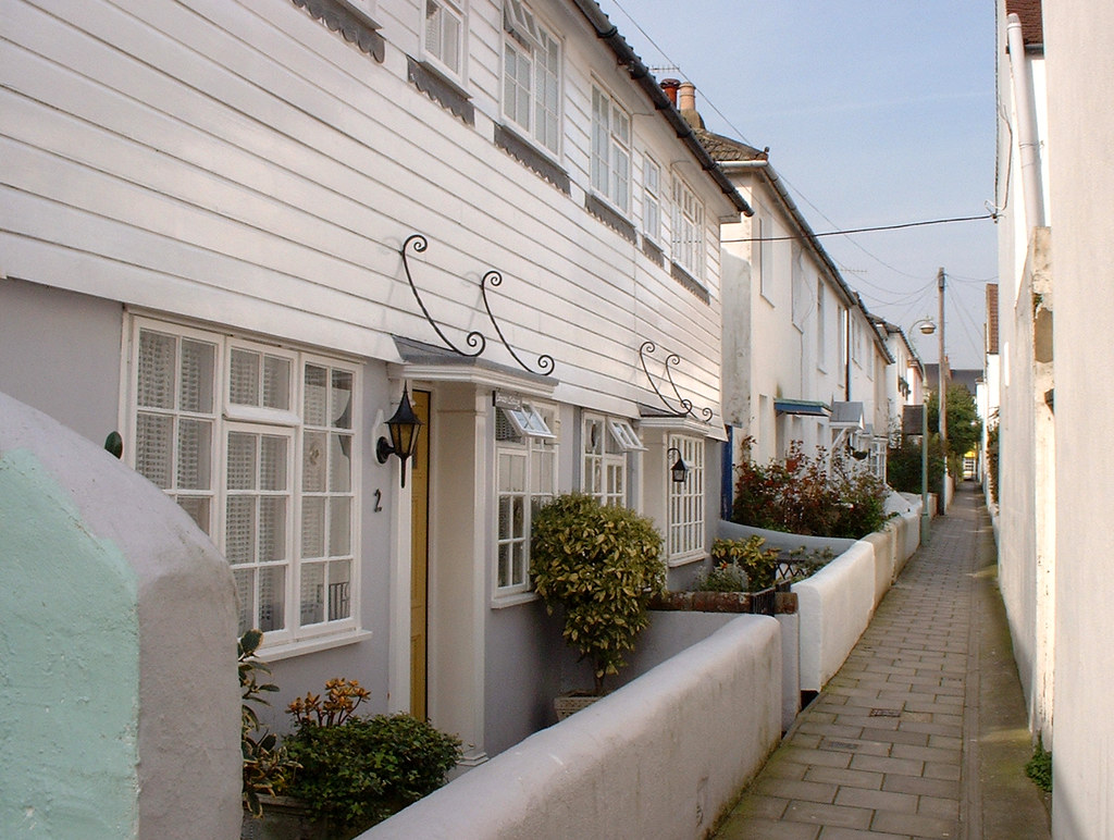 White weatherboard home exterior repaint